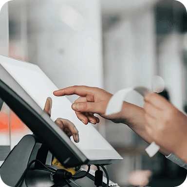 SpotOn logo over an image of a person using a touchscreen device